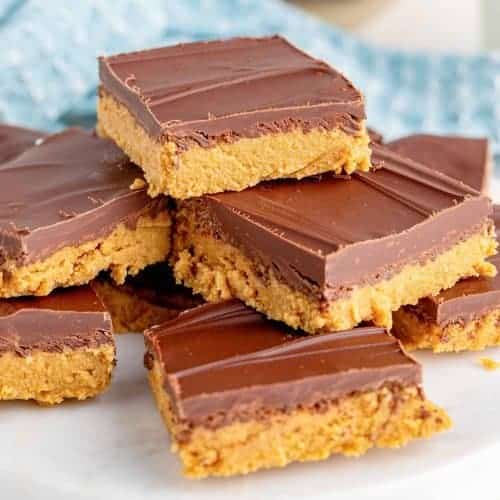 no bake peanut butter bars cut into square and stacked